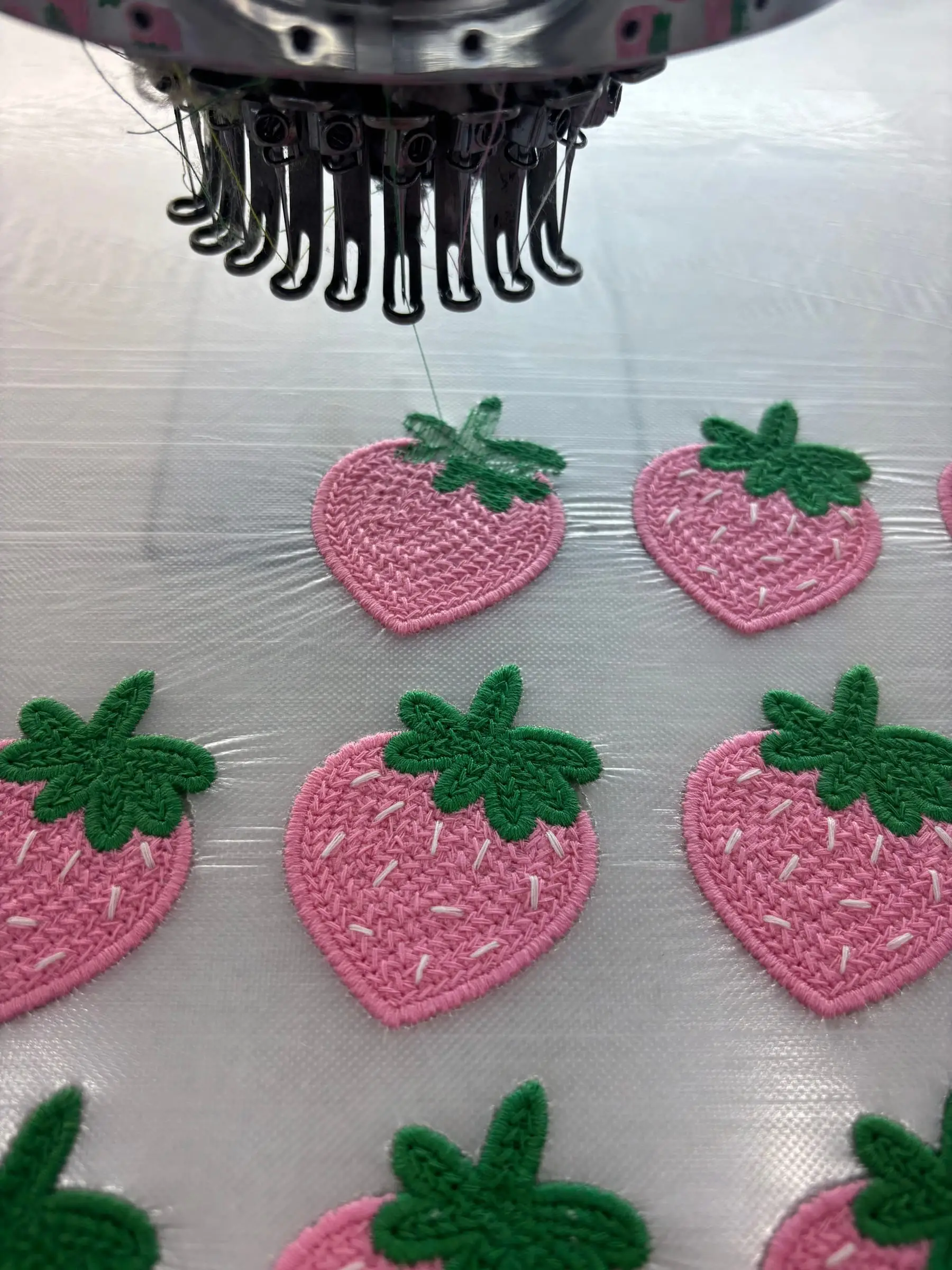 Finished embroidered patches, dense stitch and clean edges, straight off the machine.