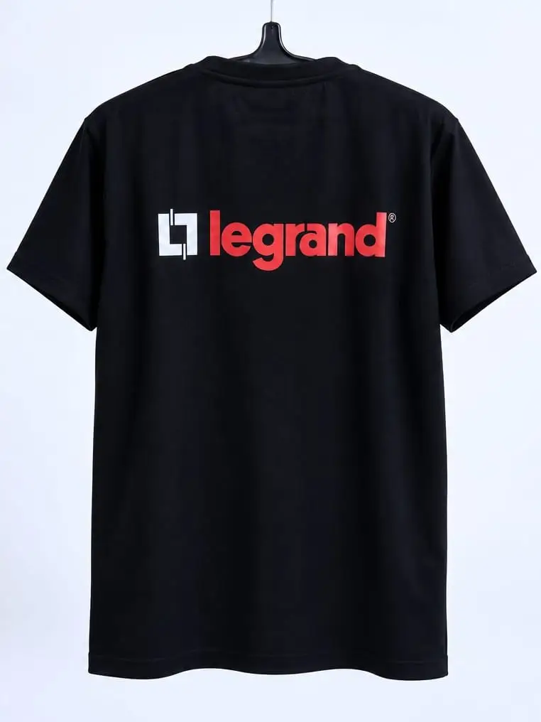 The black Legrand t-shirt on a hanger, back: the logo printed large across the shoulders.