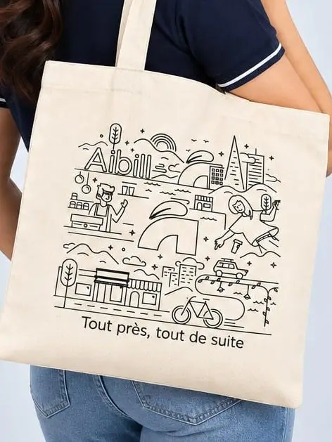 The reverse of the Aibill tote: a line-drawn city illustration printed in black, the tagline beneath.